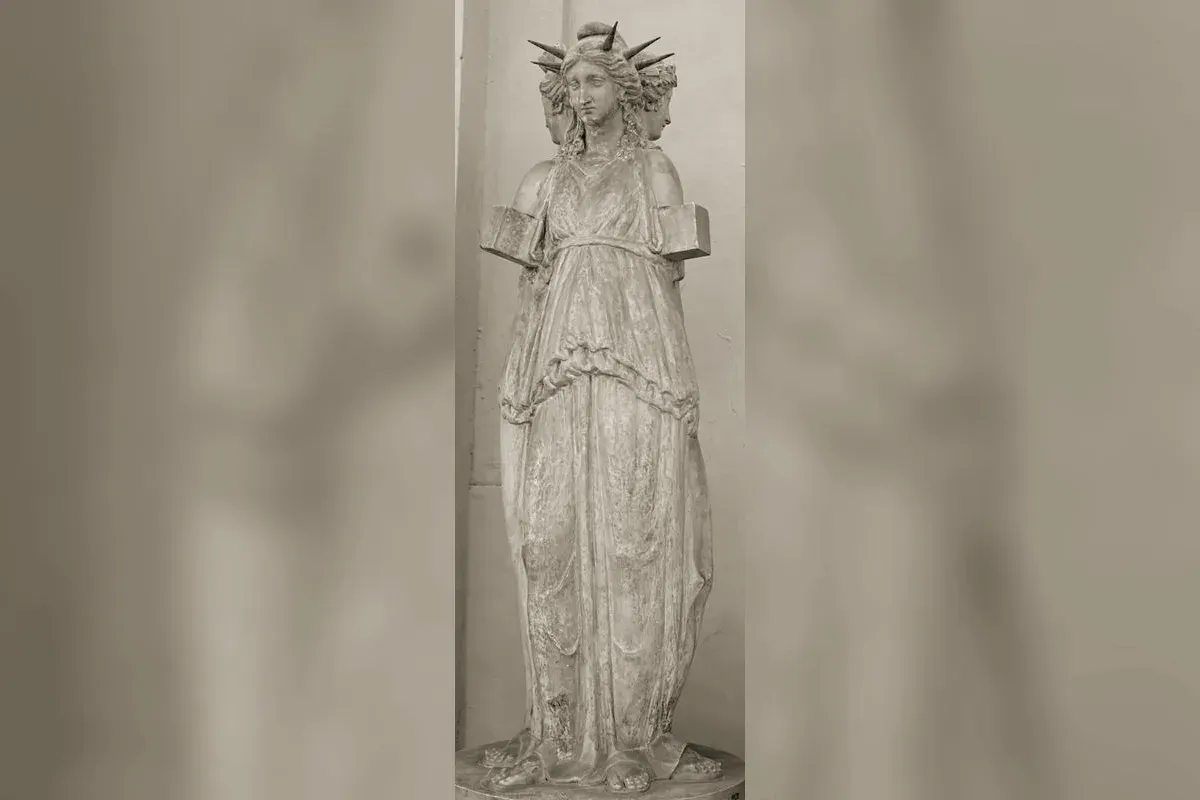 Triple-formed Hecate holding torches, ancient statue with three bodies back to back